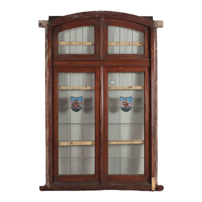 a four panel mahogany window set in frame with leaded glass having ship motif 5175