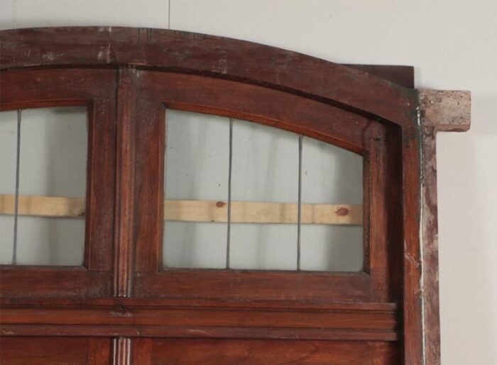 a four panel mahogany window set in frame with leaded glass having ship motif 6788