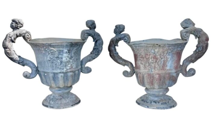 a pair of neoclassical lead urns planters 5135