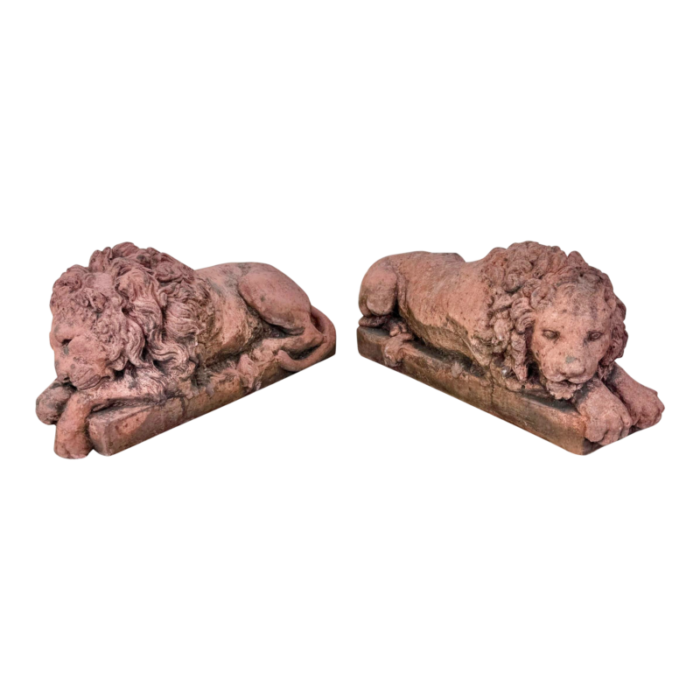 a pair of terracotta recumbent lion statues 2028