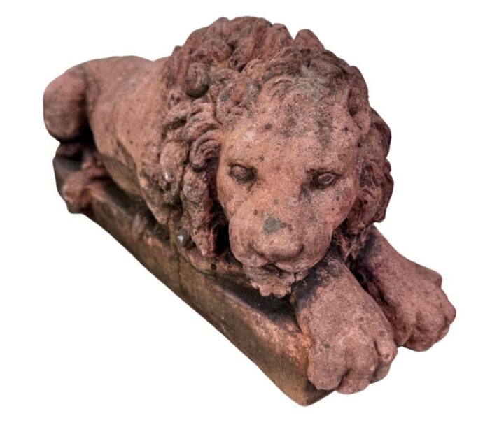 a pair of terracotta recumbent lion statues 7671