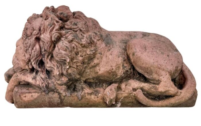 a pair of terracotta recumbent lion statues 8395