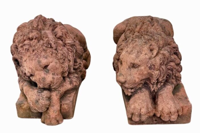 a pair of terracotta recumbent lion statues 8808