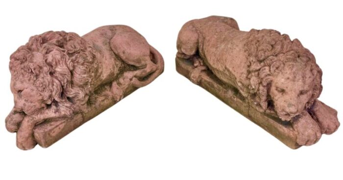 a pair of terracotta recumbent lion statues 9442