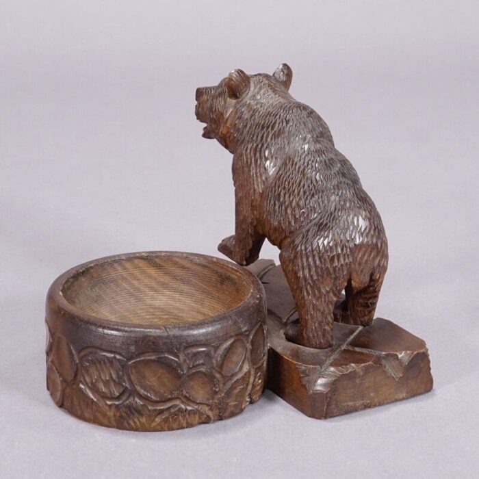 a wooden carved black forest bear with bowl ca 1920s 3865