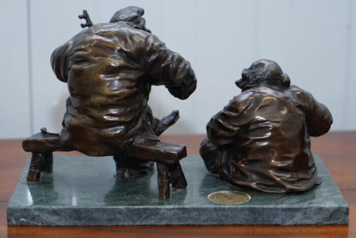 antique bronze statue of 2 men one a solid green soapstone base 15