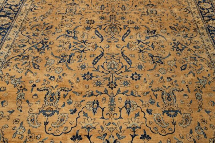 antique persian kerman wool rug handmade in tan featuring an allover motif 1933