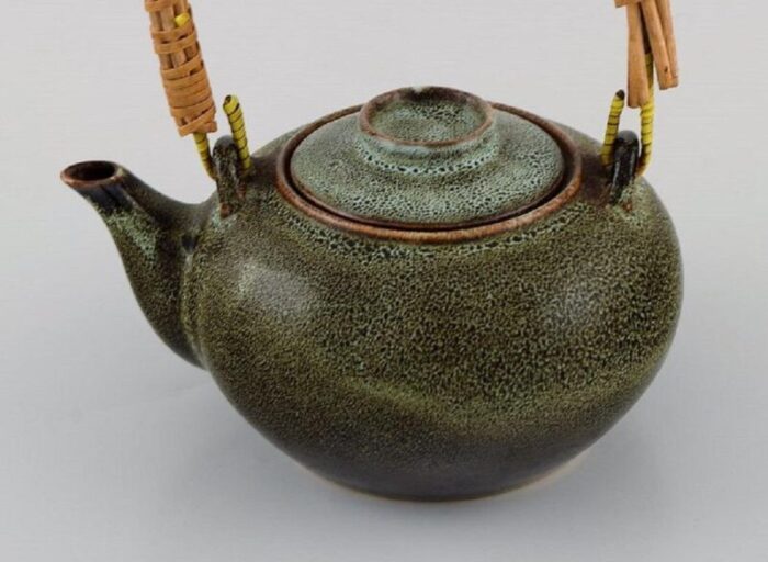 chinese teapot in glazed stoneware with wicker handle 20th century 2