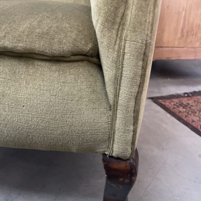 early 20th century pair of olive green upholstered velvet armchairs on rollers 2351