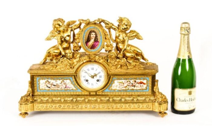 french gilt bronze clock with portrait plaque of moliere 19th century 17