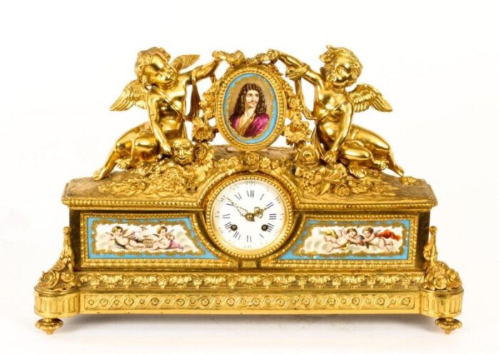 french gilt bronze clock with portrait plaque of moliere 19th century 18