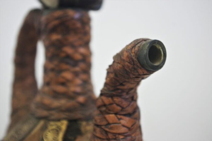 glass bottle covered in rope of leather and hair 1950s 8