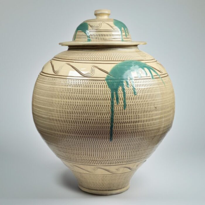 large mid 20th century onta water jar with chatter marks and green uchikake splash decoration 2349