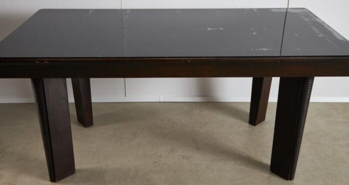 large robust dining table with carved legs and glass top 4485