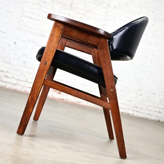 mid 20th century mid century modern madison furniture single oak armchair with oak frame and black vinyl 0319