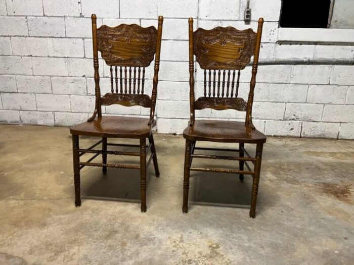 mid 20th century set of four vintage solid pressed back tiger oak carved dining chairs 0649