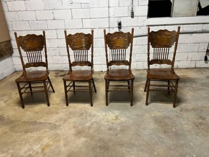 mid 20th century set of four vintage solid pressed back tiger oak carved dining chairs 3644